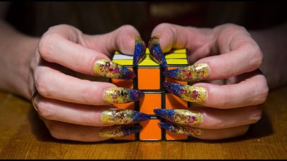 ASMR ear to ear sound riggers tingle solving Rubik’s cube
